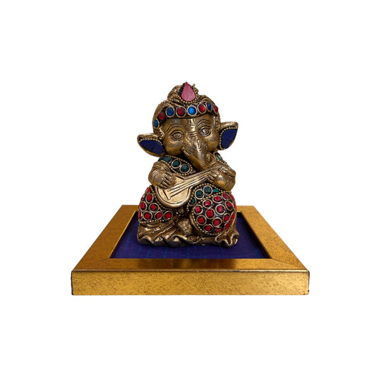 Handcrafted Lord Ganesha Idols with Colorful Stones – Brass Finish on Blue Silk Base
