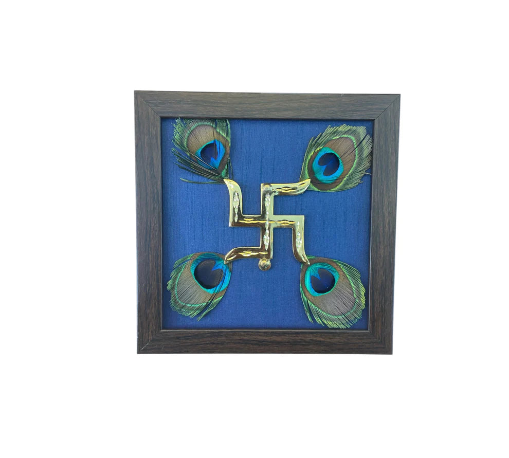 Brass Swastik with peacock feather & wine red silk in Gold frame