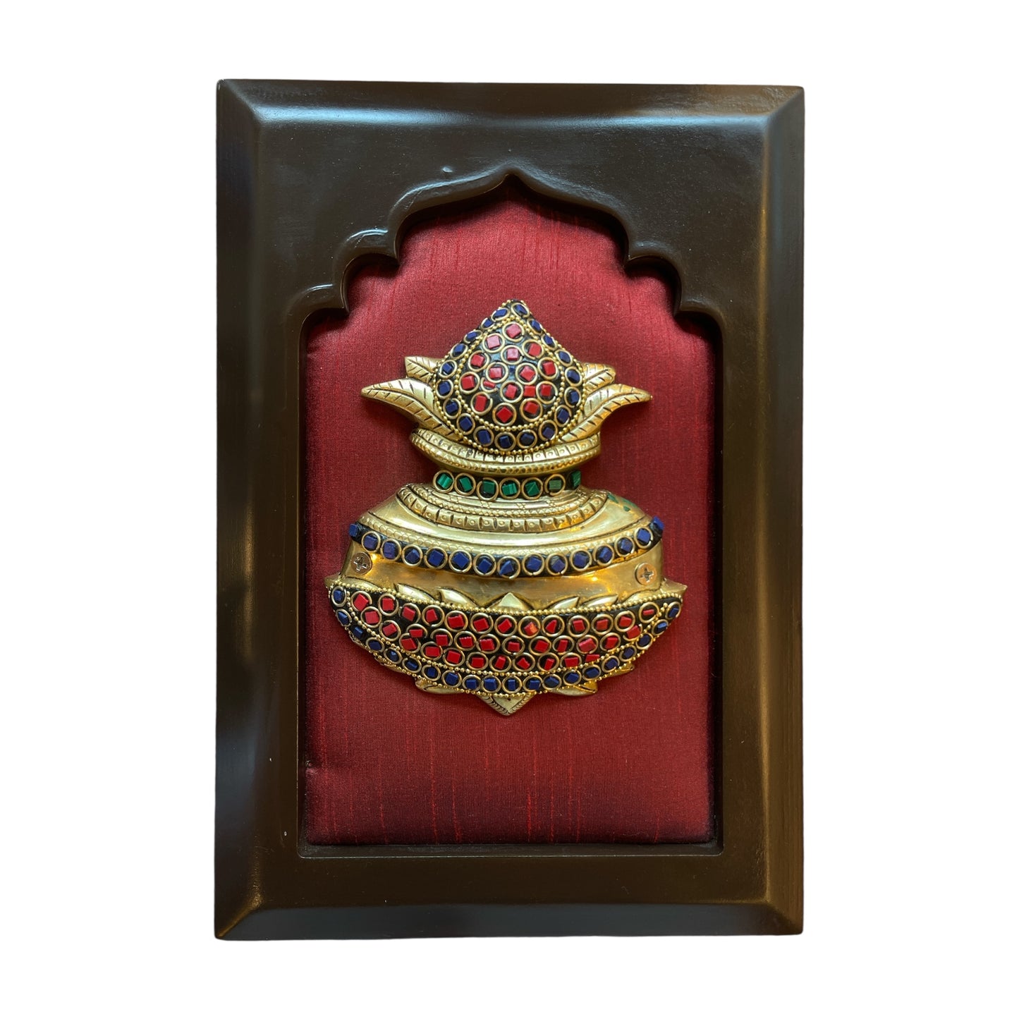 Brass kuber kalash with stone work on wine red silk in wooden frame