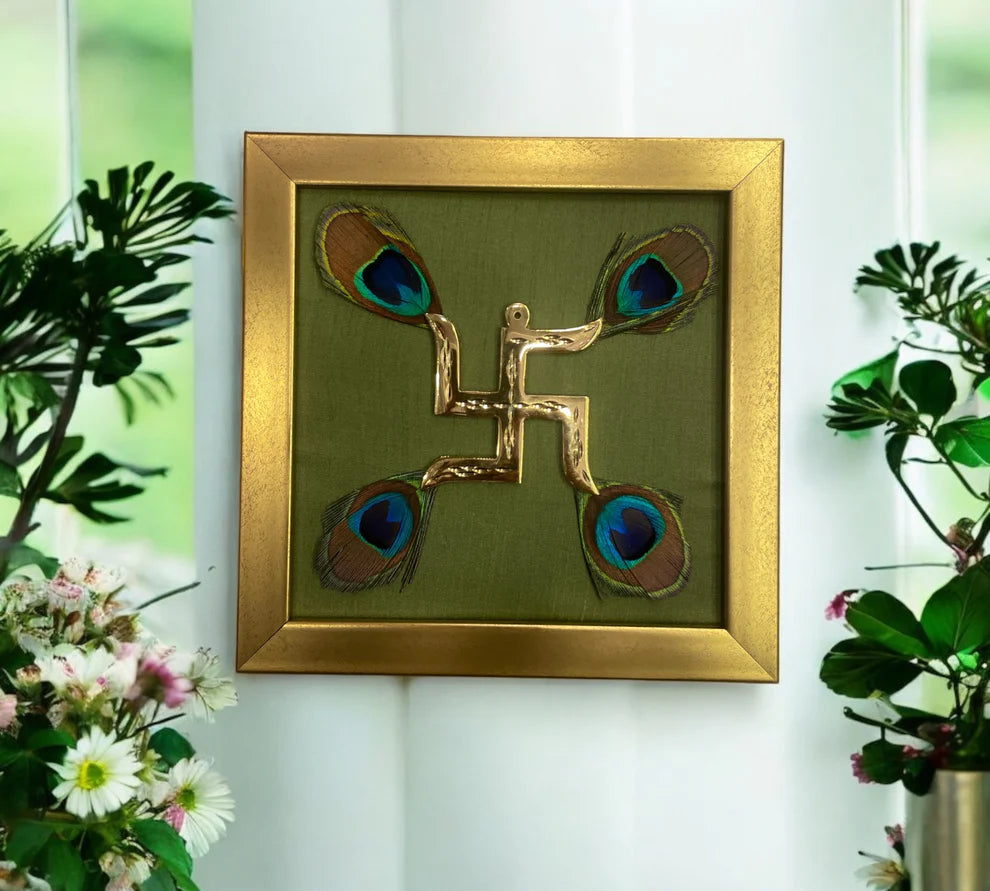 Brass Swastik with peacock feather & wine red silk in Gold frame
