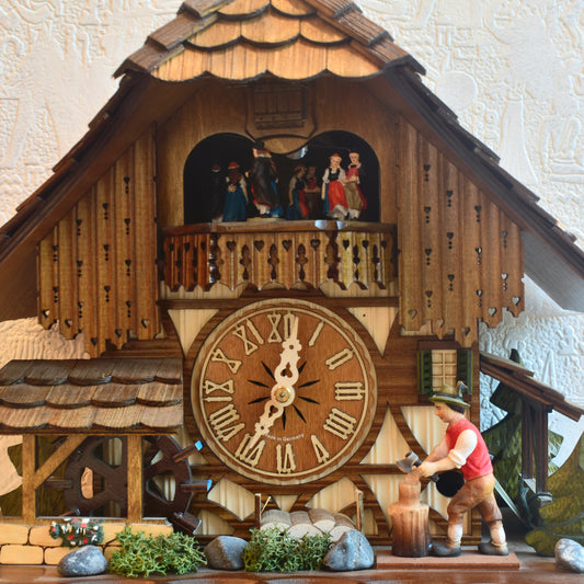 Musical mechanical cuckoo clock - with wood cutter and German farm dance moving parts - 8 day movement