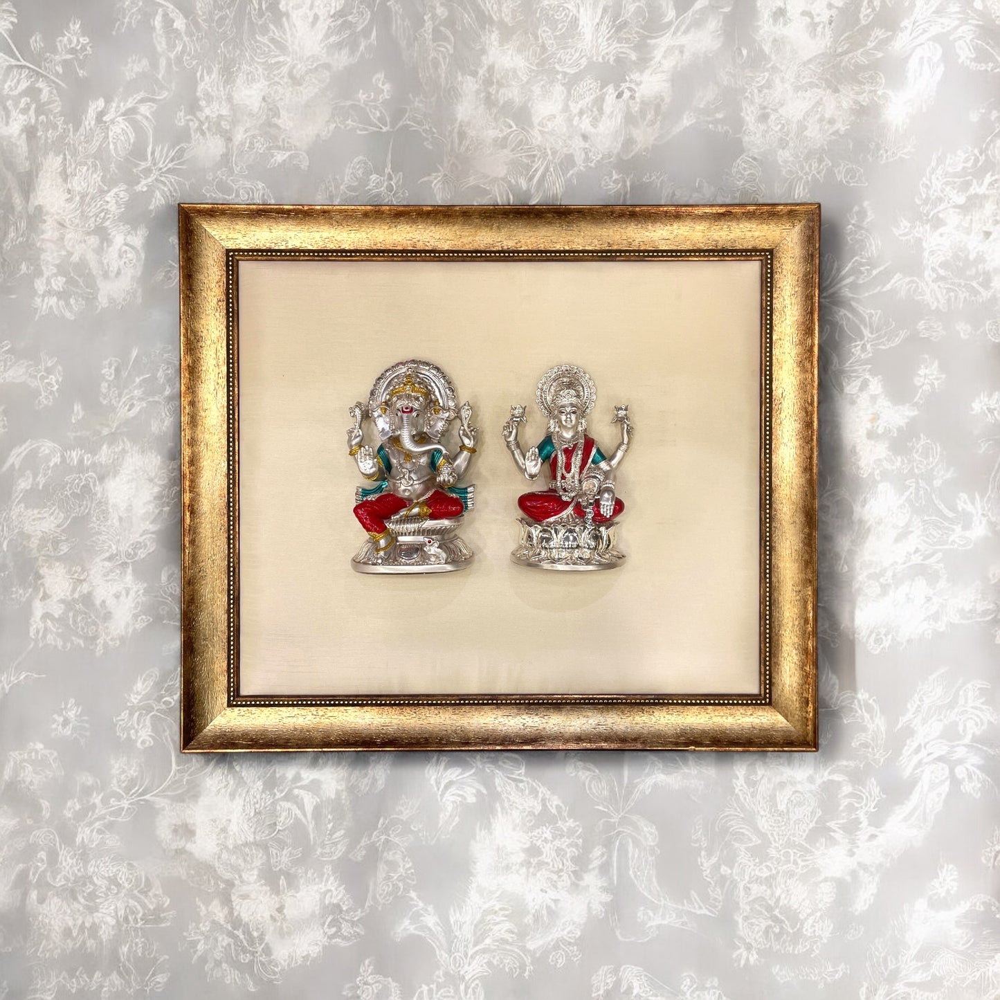 Ganesh Laxmi Silver on White Silk Backdrop in Antique Gold Moulded Frame