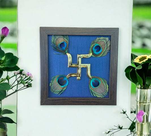 Brass Swastik with Peacock Feather and Blue silk in brown Frame