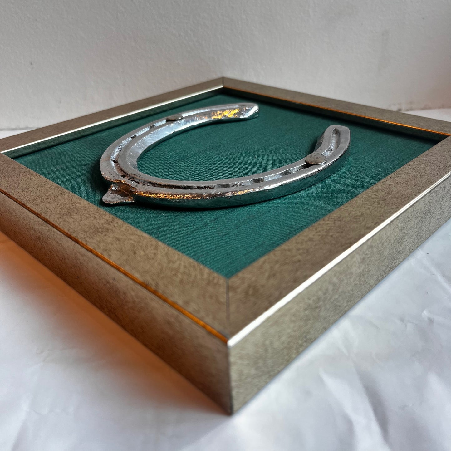 Good Luck Horse Shoe with Rama Green silk background