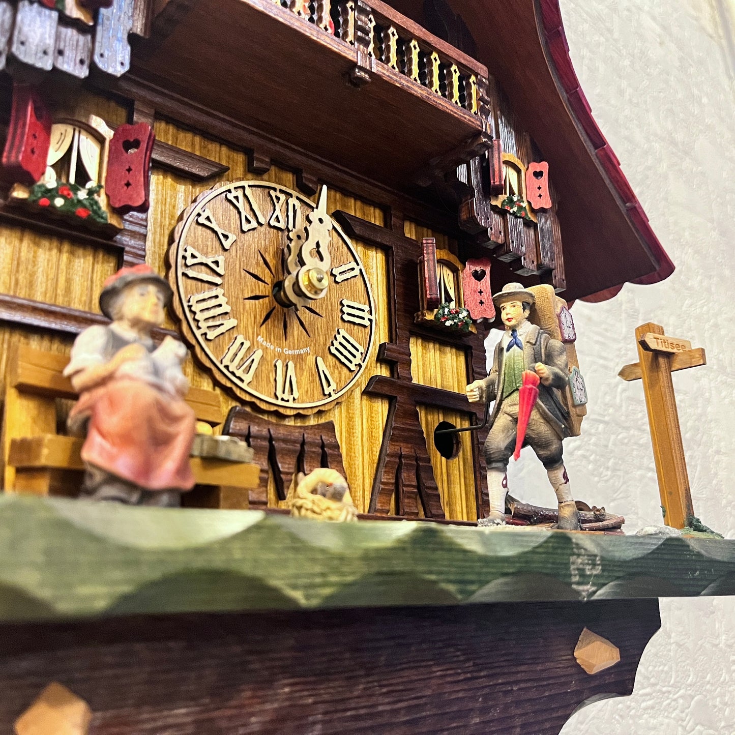 Musical 8 day mechanical cuckoo clock with clock seller and German farm dance movement