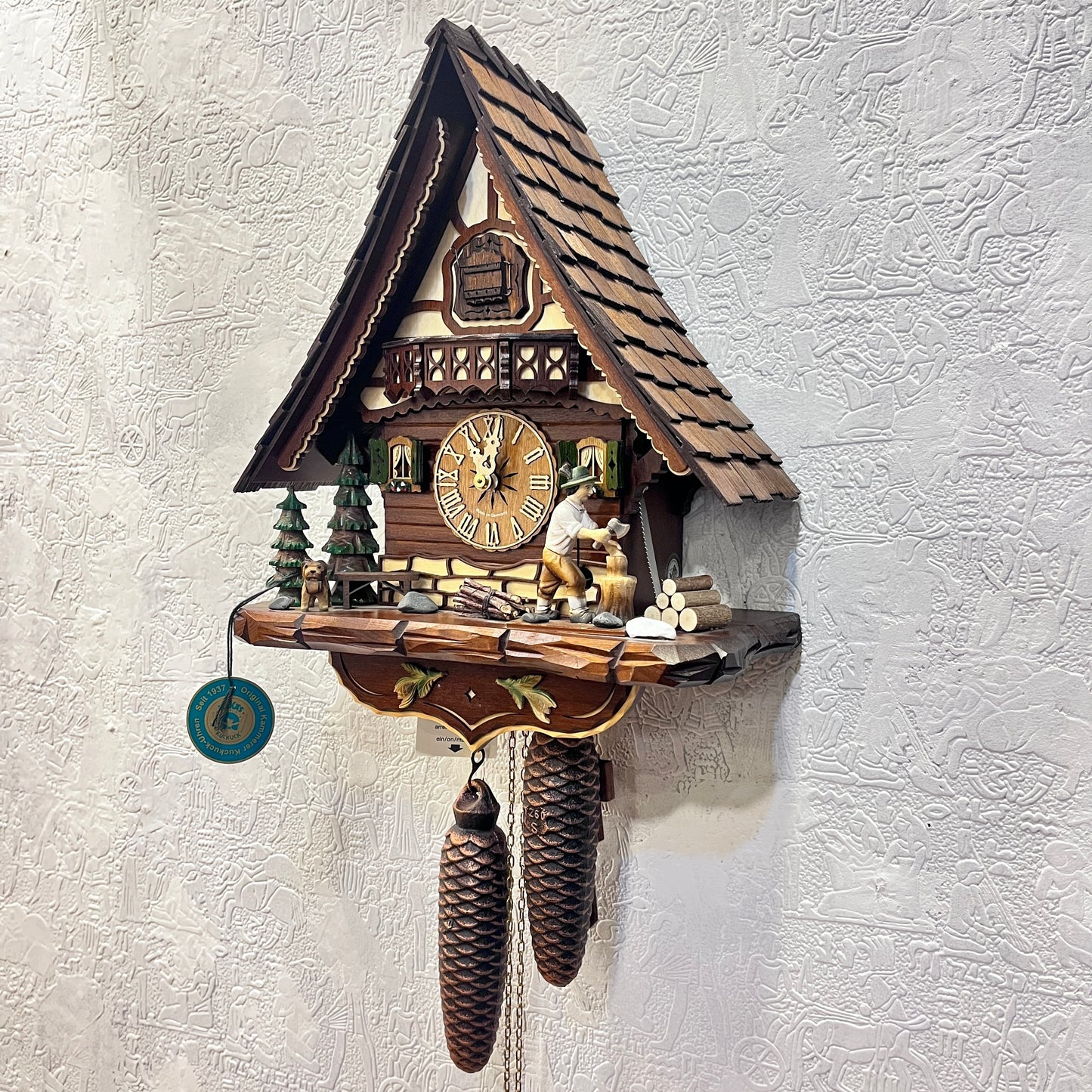 Mechanical original cuckoo clock with wood cutter with pine trees and dog miniature - 8 day Movement