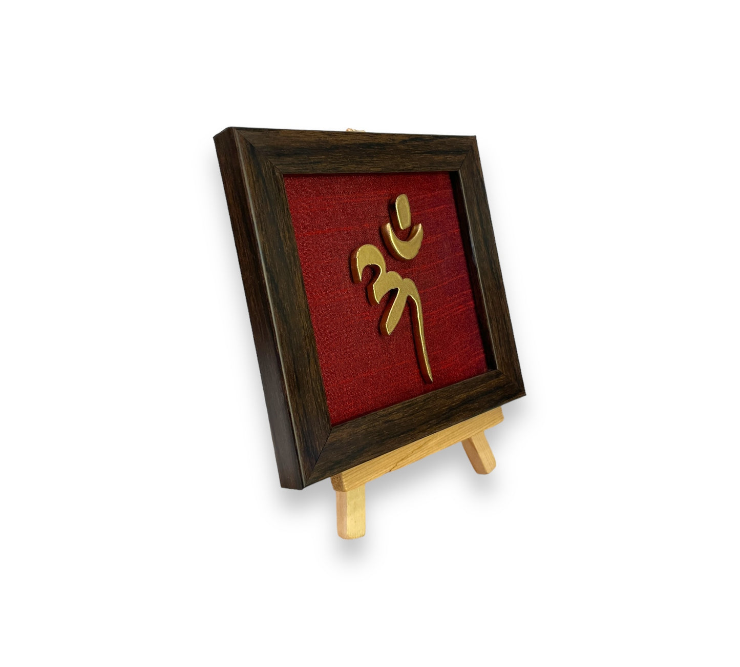 Vastu Aum
Symbol in Metal on Wine red silk backdrop.