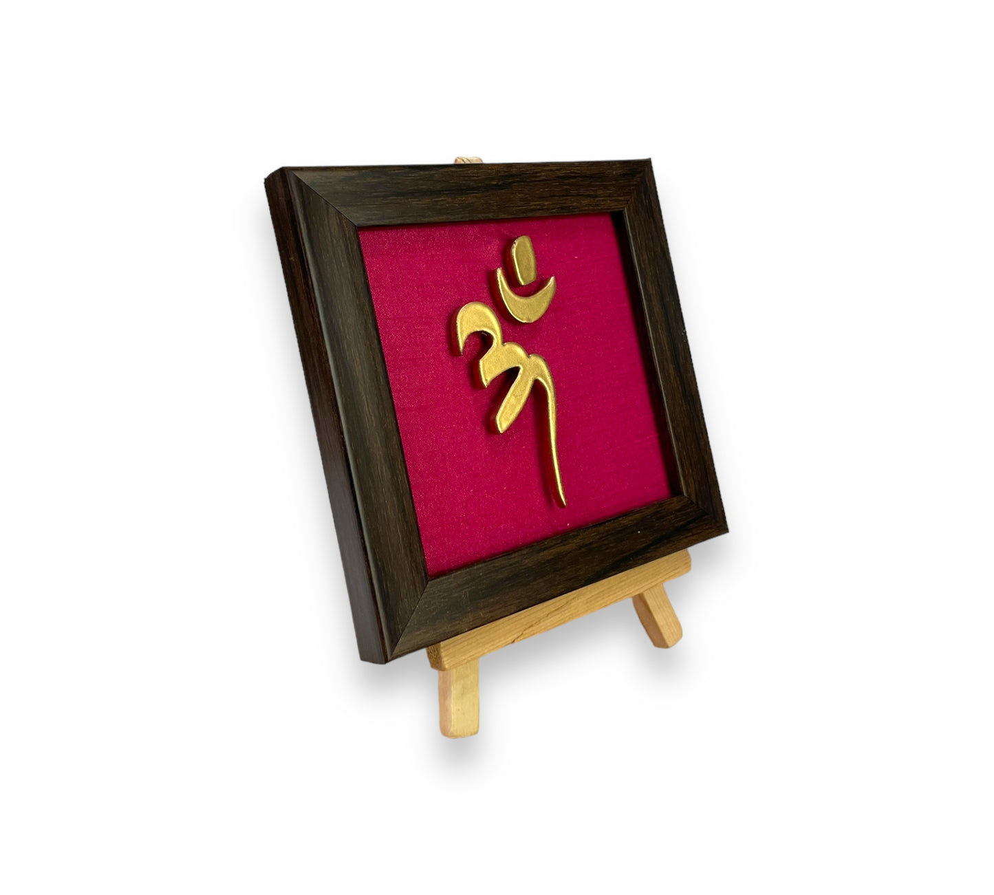 Vastu Aum
Symbol in Metal on Rani pink silk backdrop.