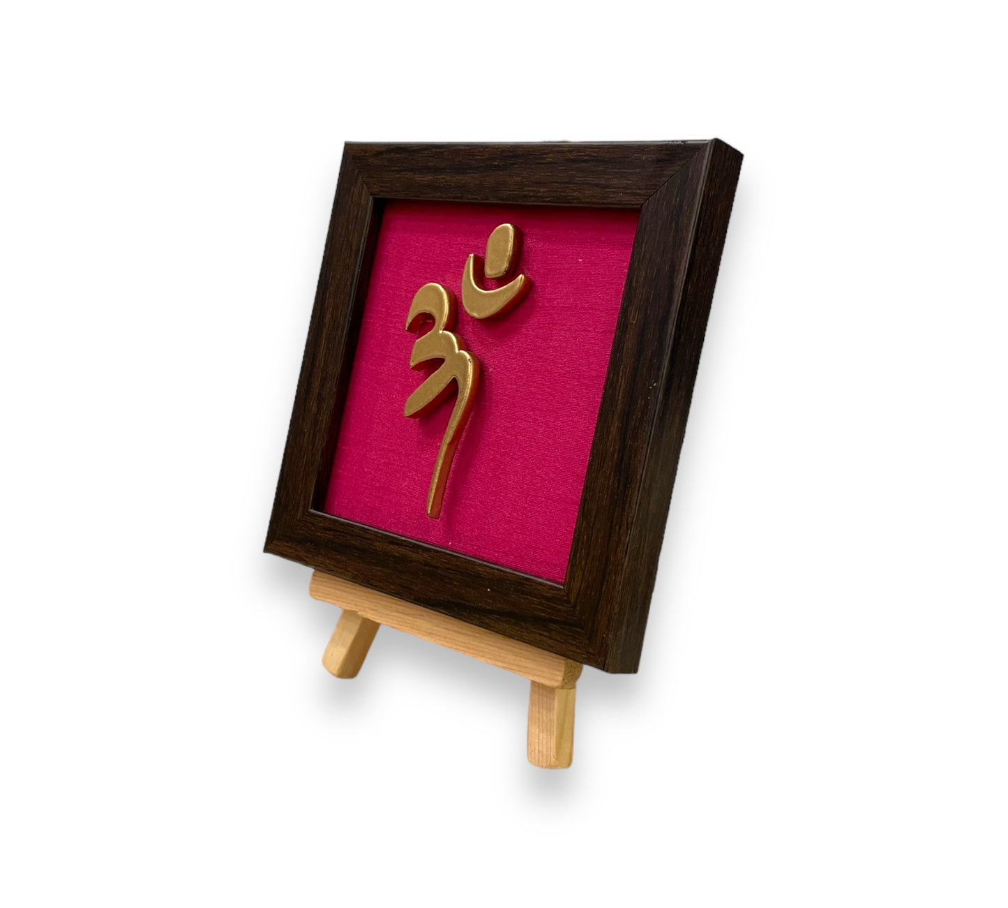 Vastu Aum
Symbol in Metal on Rani pink silk backdrop.