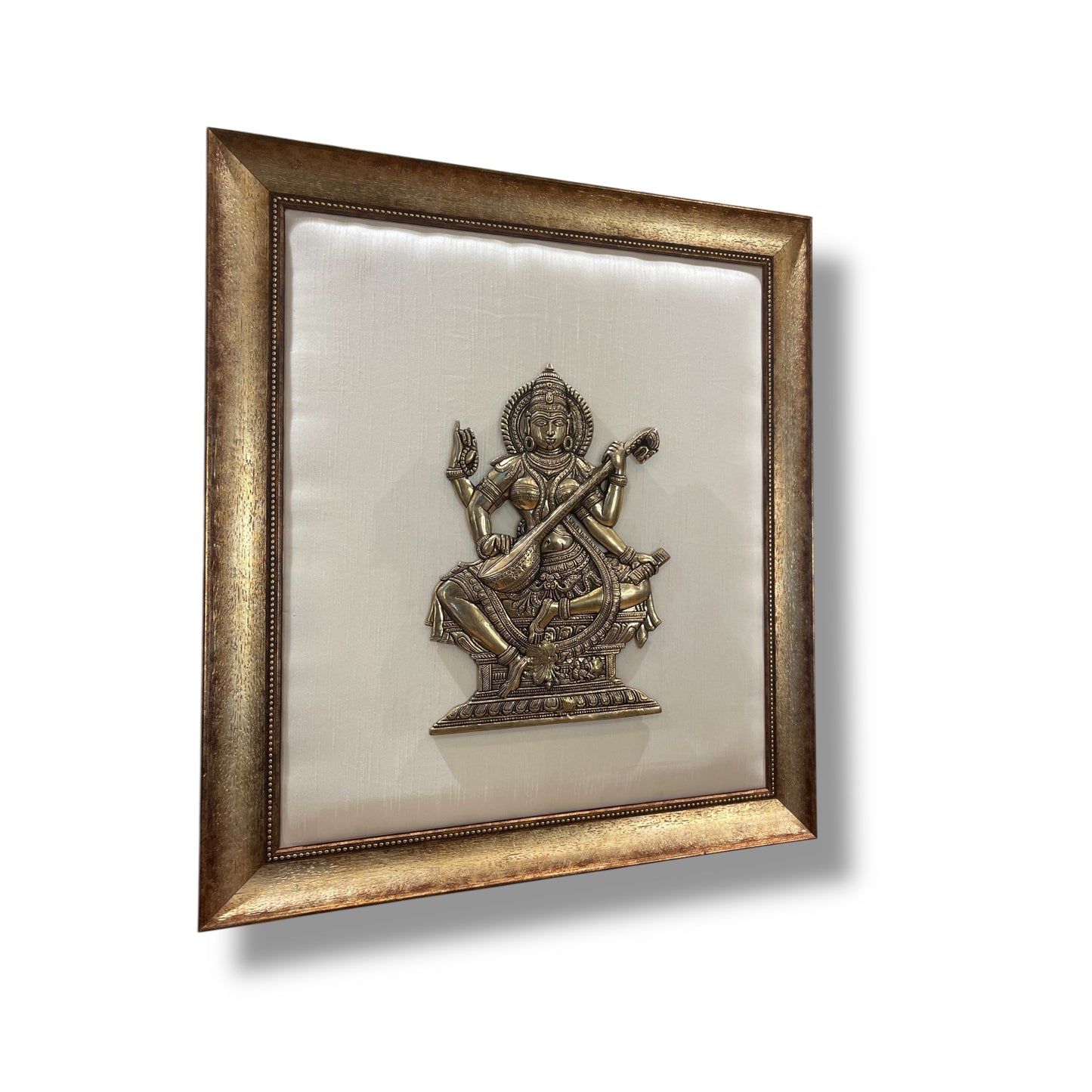 Brass Saraswati on White silk Backdrop in Wooden frame