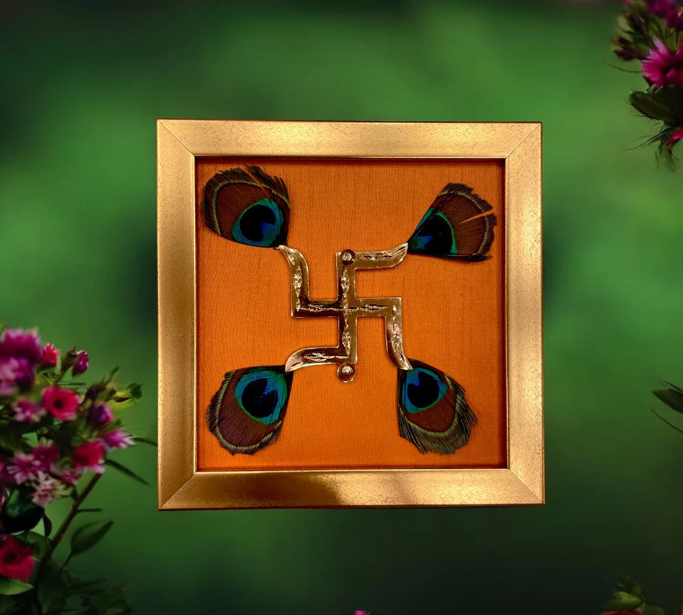 Brass Swastik with peacock feather & wine red silk in Gold frame
