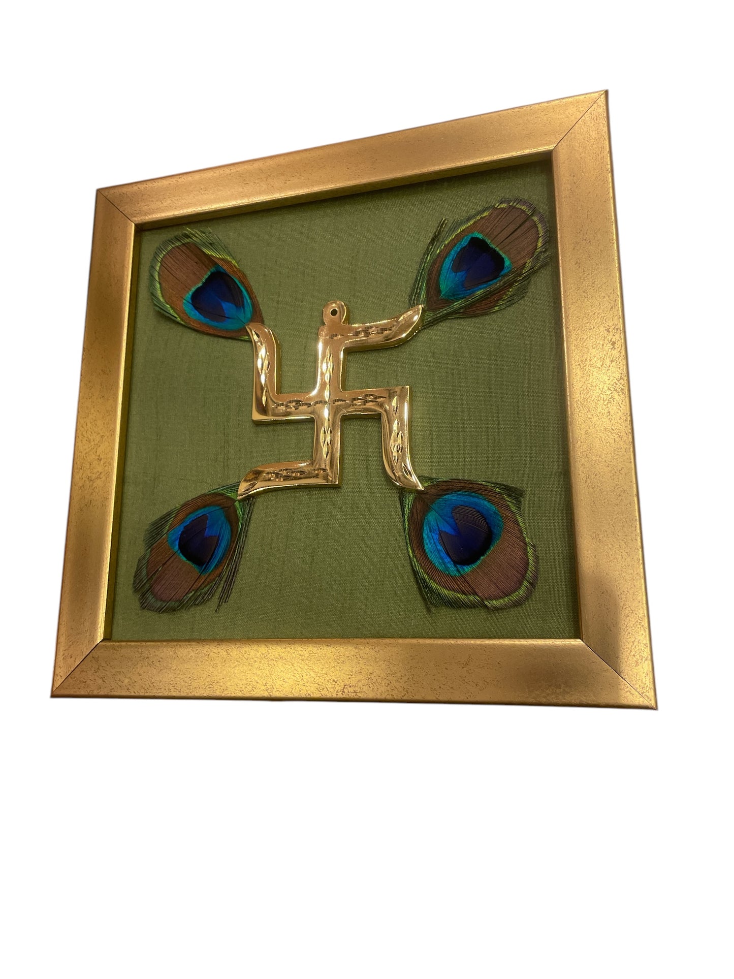 Brass Swastik with peacock feather & Green silk in Gold frame
