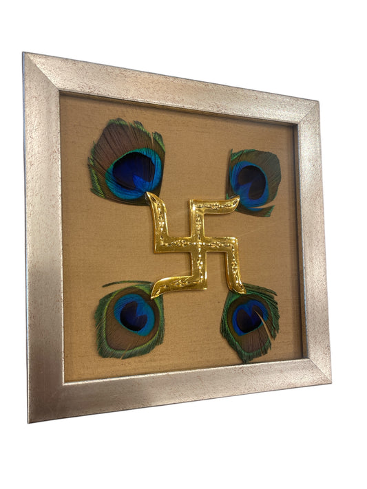 Brass swastik with Golden silk and peacock Feather in. Antique gold frame