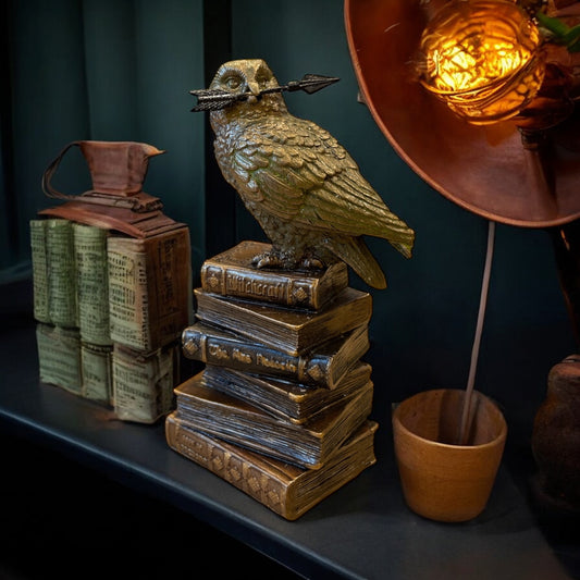 Bronze Owl Figurine Sitting on a Stack of Antique Books