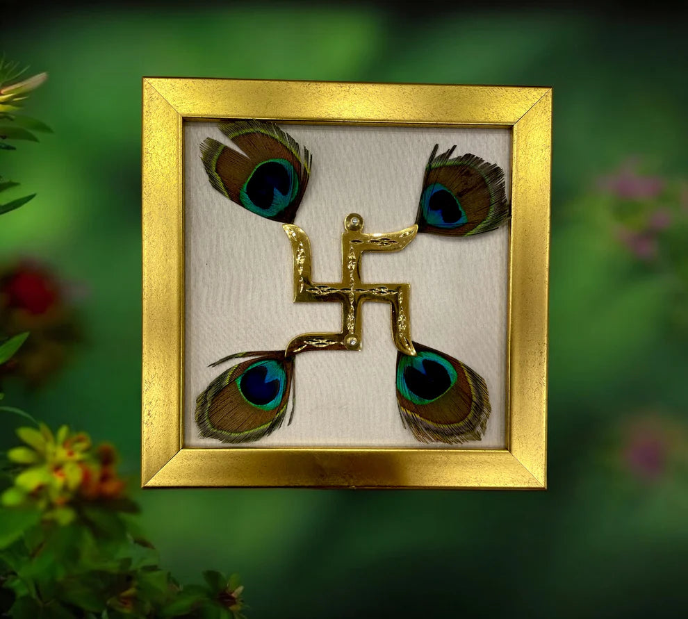 Brass Swastik with peacock feather & wine red silk in Gold frame