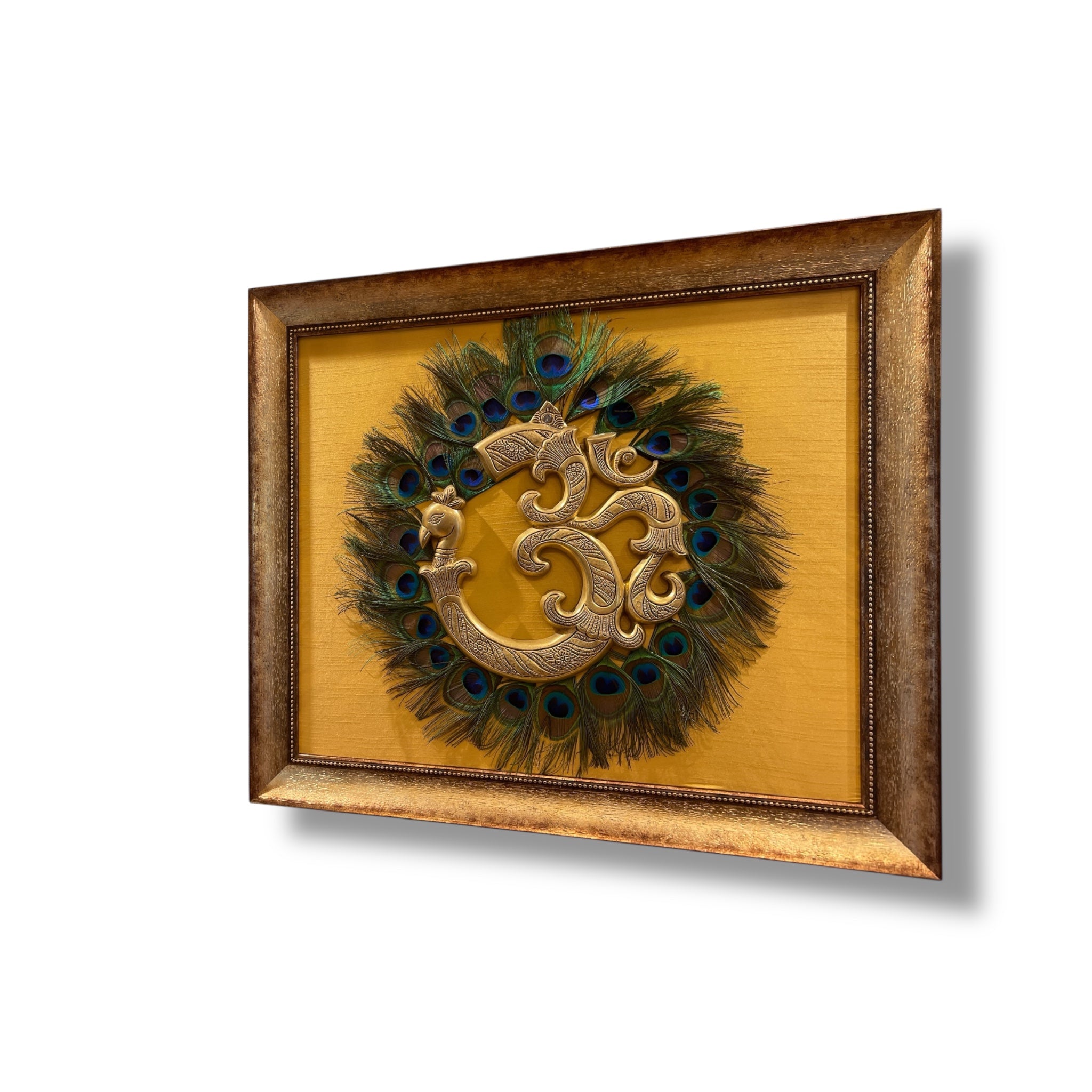 Brass Om with Peacock Feathers on Golden Silk in Moulded Frame