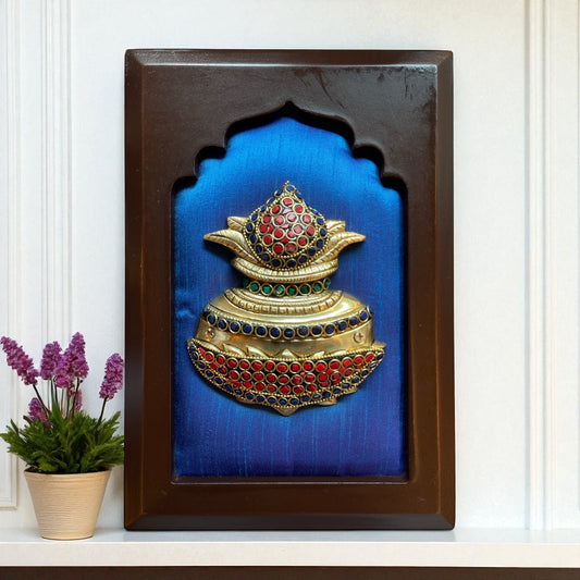 Brass kuber kalash with stone work on Blue silk in wooden frame