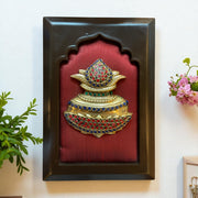 Brass kuber kalash with stone work on wine red  silk in wooden frame