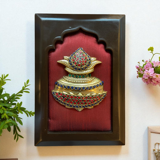 Brass kuber kalash with stone work on wine red  silk in wooden frame
