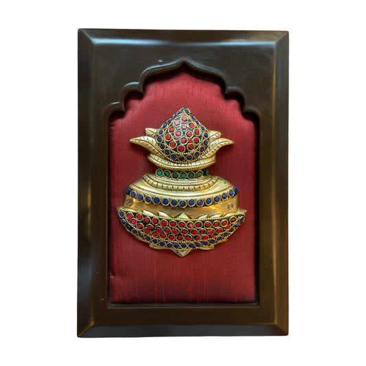 Brass kuber kalash with stone work on wine red  silk in wooden frame