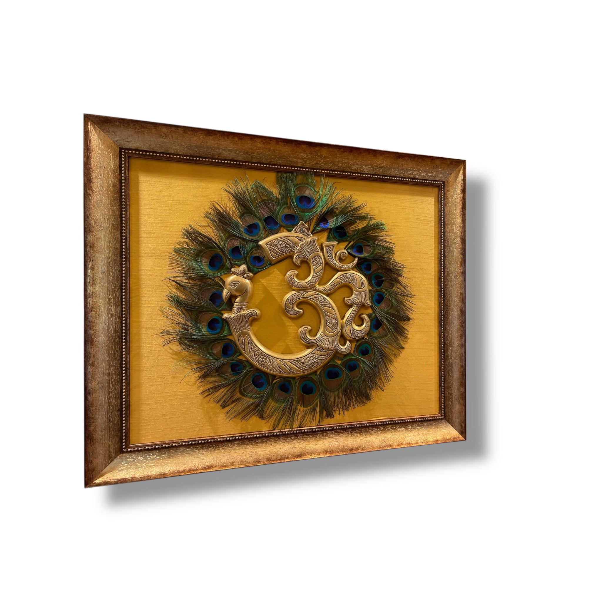 Brass Om with Peacock Feathers on Golden Silk in Moulded Frame