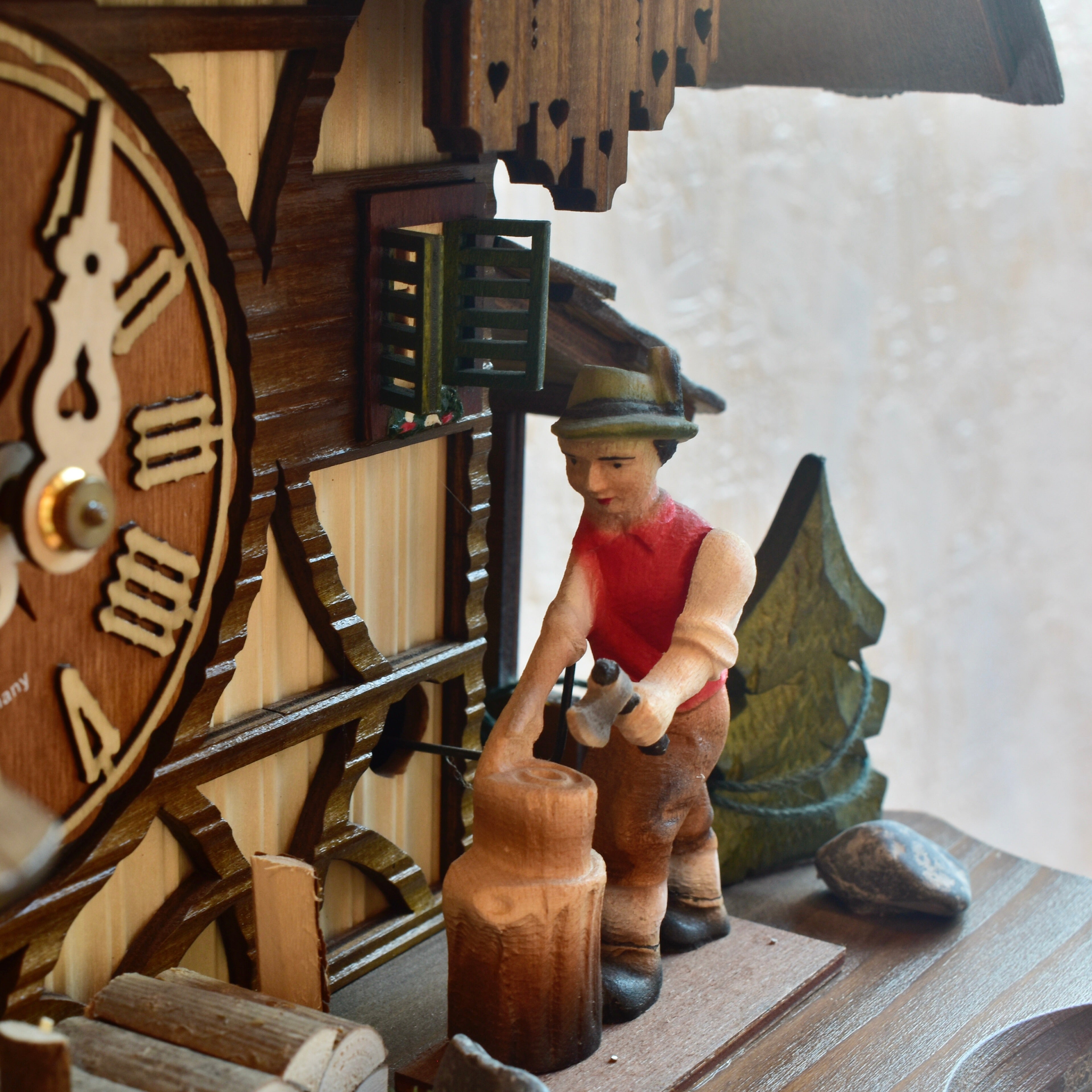 Musical mechanical cuckoo clock - with wood cutter and German farm dance moving parts - 8 day movement