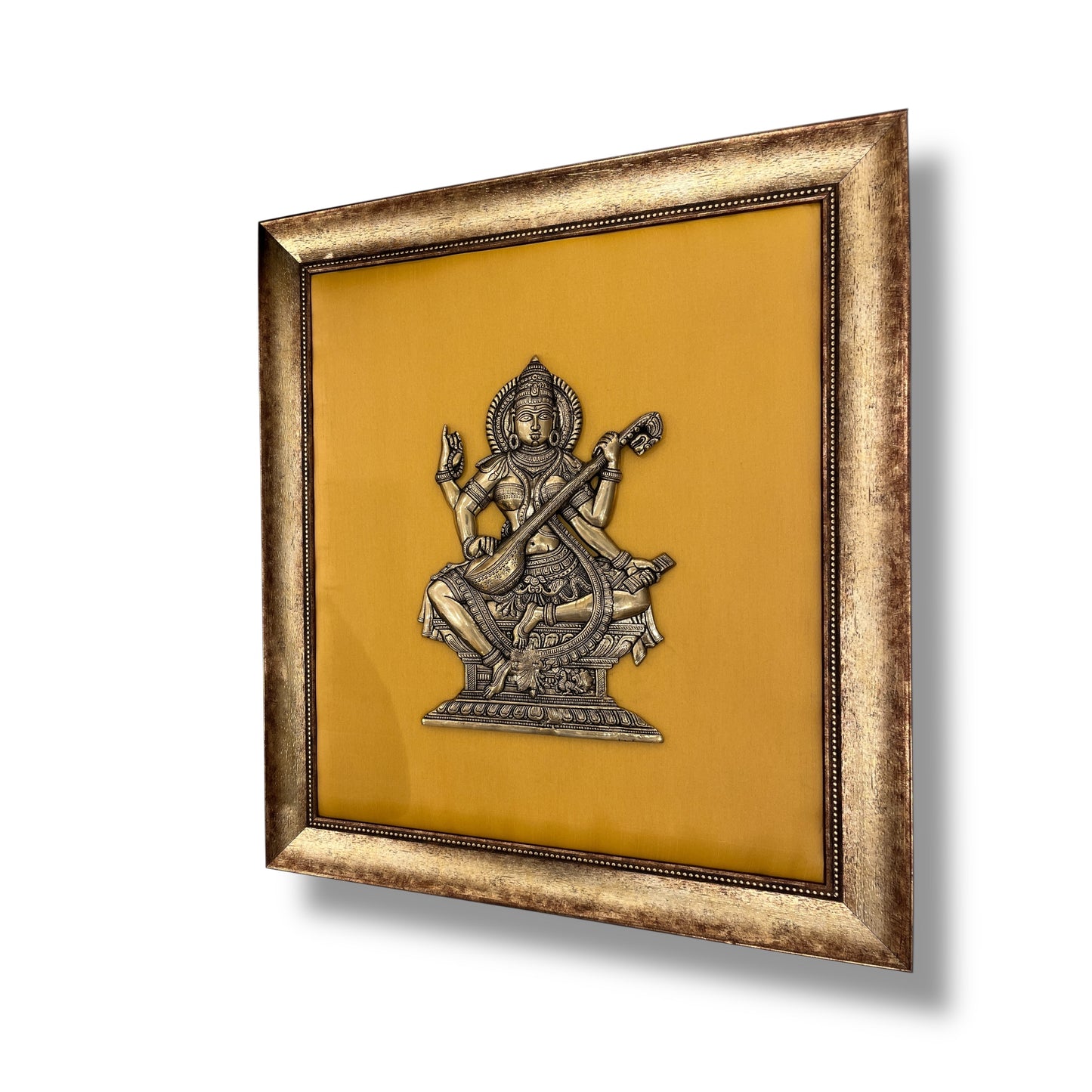 Brass Saraswati on White silk Backdrop in Wooden frame