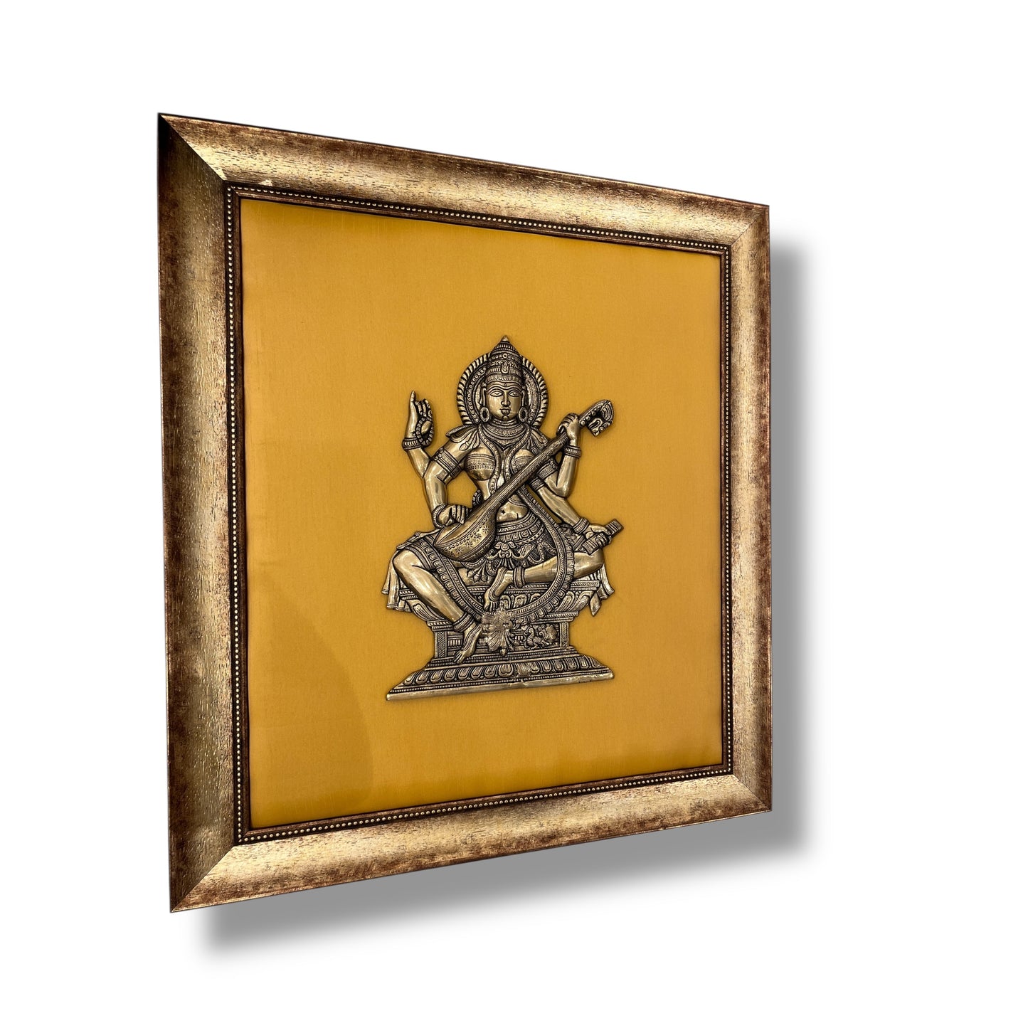Brass Saraswati on White silk Backdrop in Wooden frame