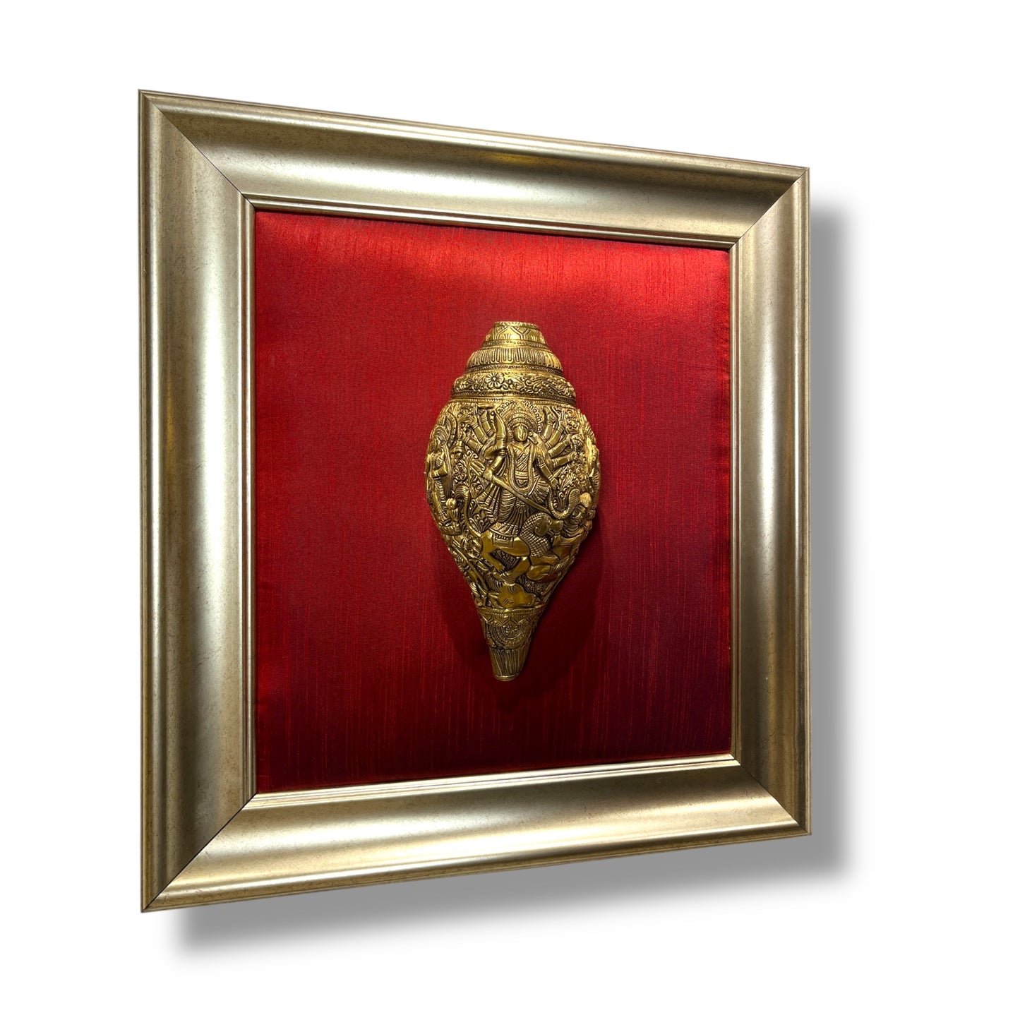 Maa Tripura Sundari Shankh with Ganesh and Kartikeya, set in an antique god frame with a wine-red silk backdrop, brass