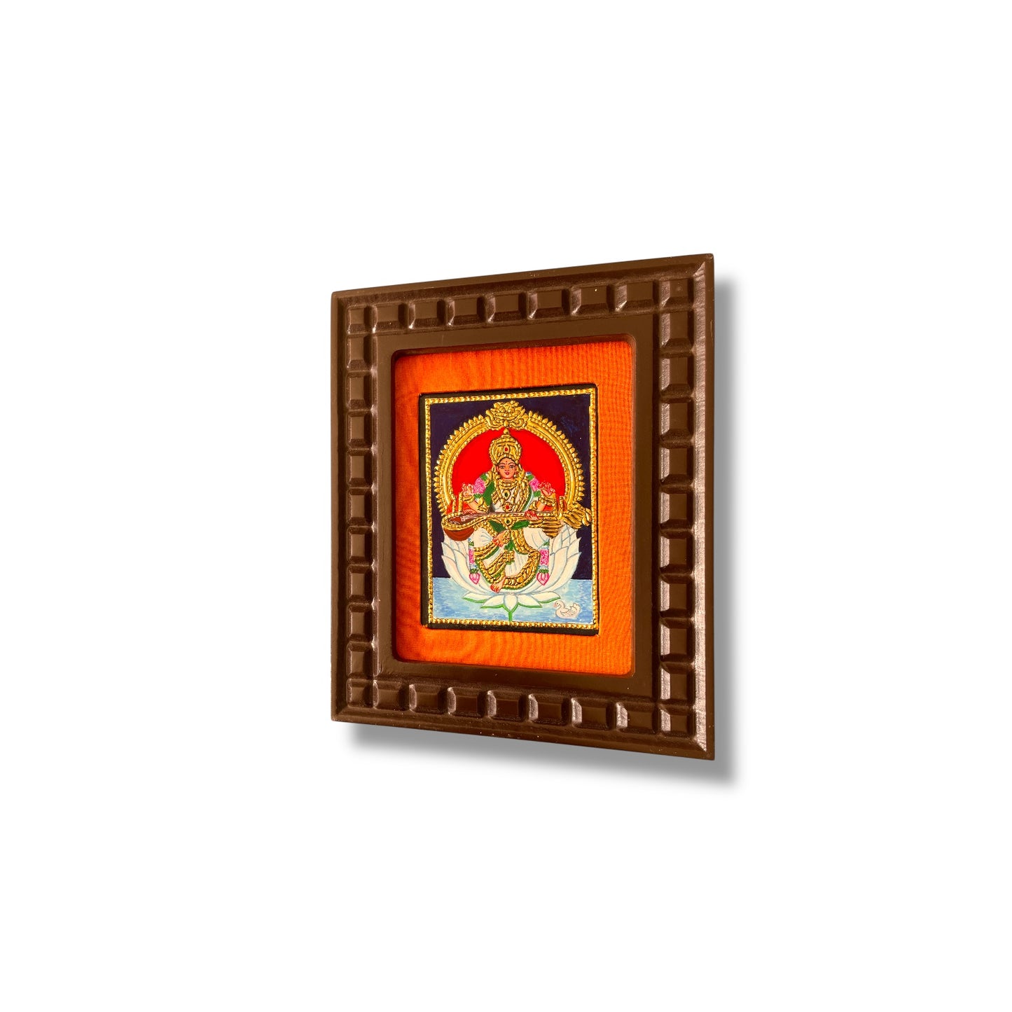 Goddess Saraswati on White Lotus Tanjore Painting – Red, Indigo Blue, Rama Green, White & Orange