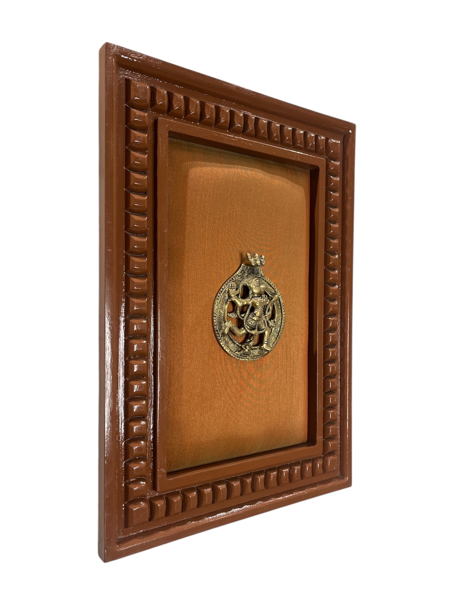 Brass Hanuman with orange silk backdrop in wooden frame