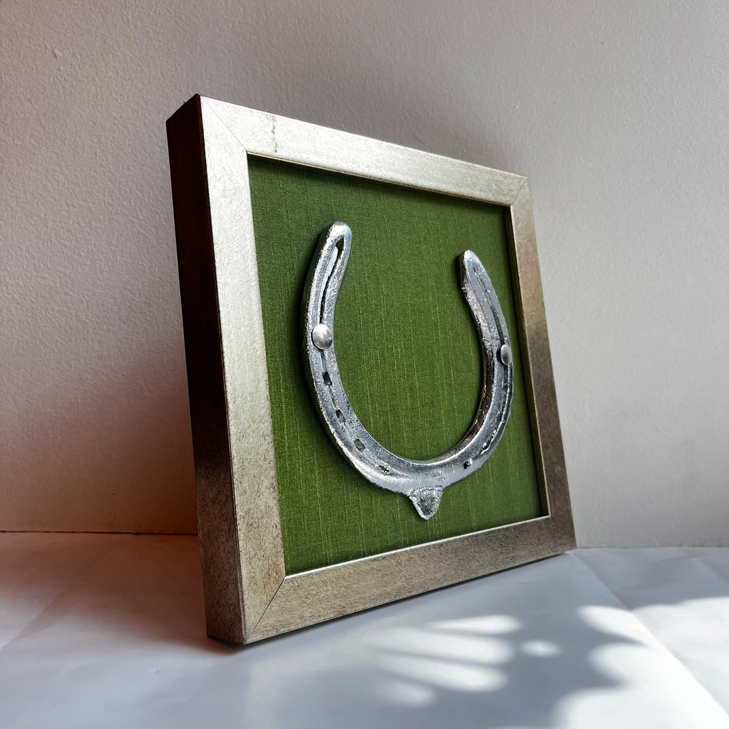 Good Luck Horse Shoe with Dark Green silk background