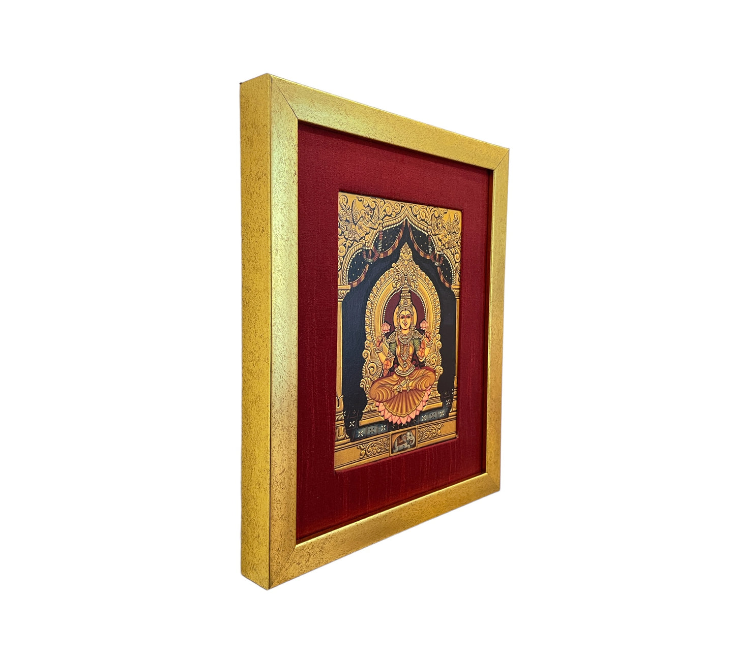 Radiant Elegance: Lakshmi Devi's Divine Presence in Red Silk with Gold Frame