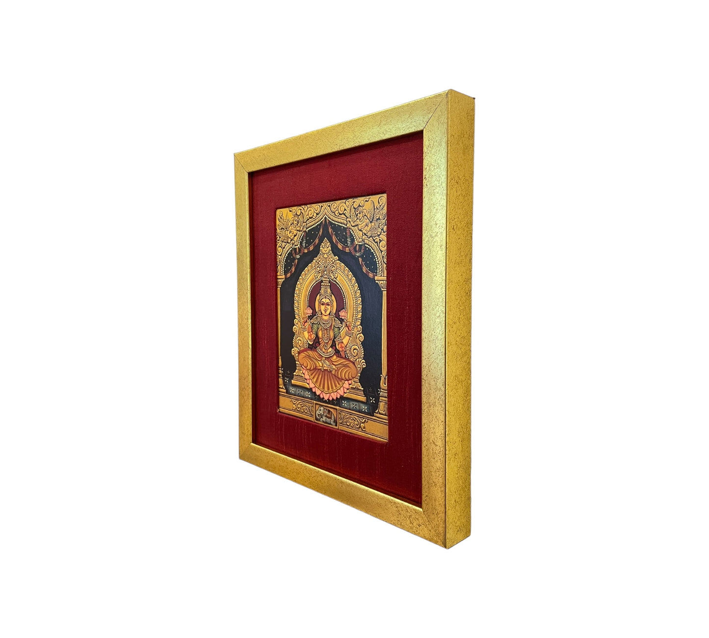 Radiant Elegance: Lakshmi Devi's Divine Presence in Red Silk with Gold Frame