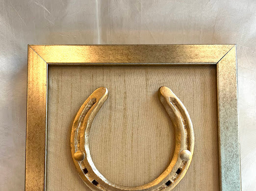 Good luck brass horse shoe with beige silk background