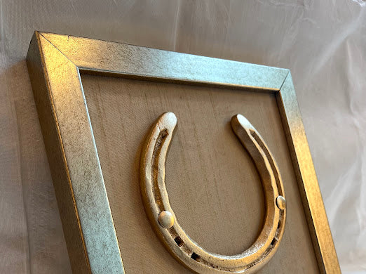 Good luck brass horse shoe with beige silk background