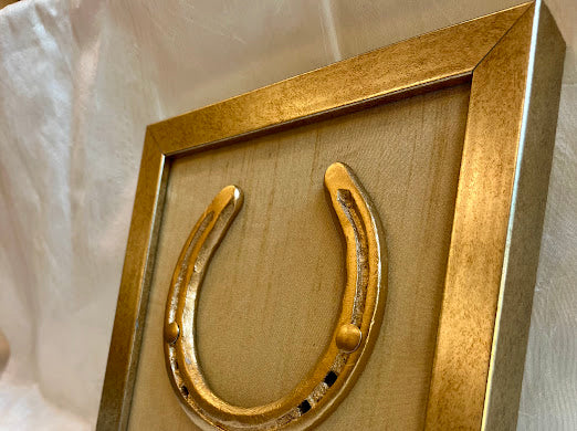 Good luck brass horse shoe with beige silk background