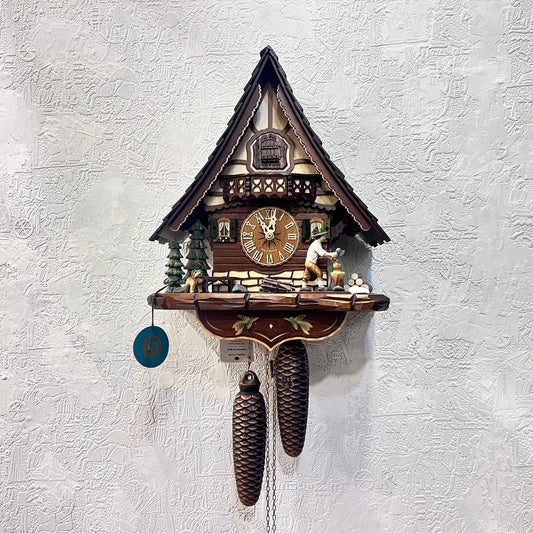 Mechanical original  cuckoo clock with wood cutter with pine trees and dog miniature - 8 day Movement