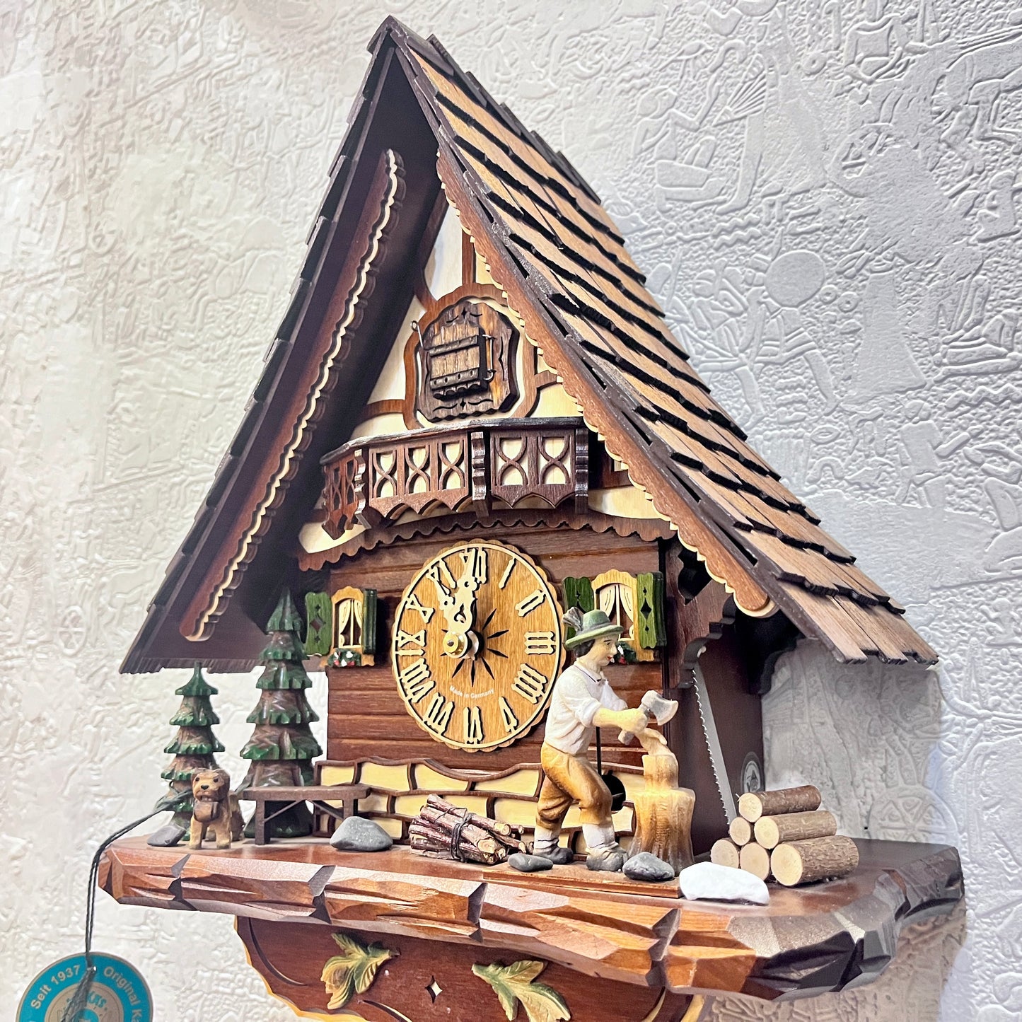 Mechanical original  cuckoo clock with wood cutter with pine trees and dog miniature - 8 day Movement