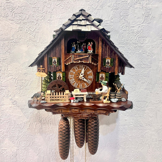 Musical cuckoo clock with beer drinking man ,German farm dance along with moving water wheel.