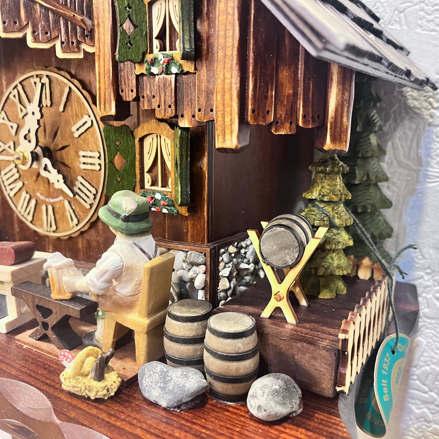 Musical cuckoo clock with beer drinking man ,German farm dance along with moving water wheel.