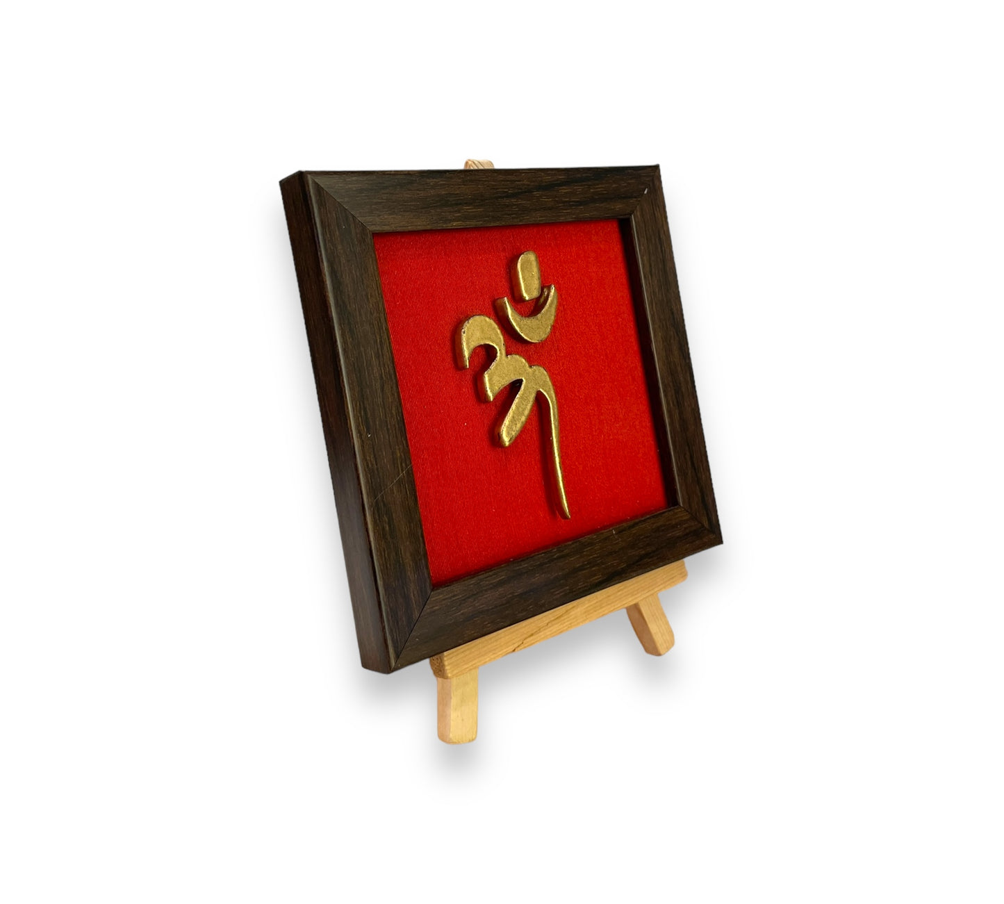 Vastu Aum 
Symbol in Metal on Red silk backdrop with a display stand.