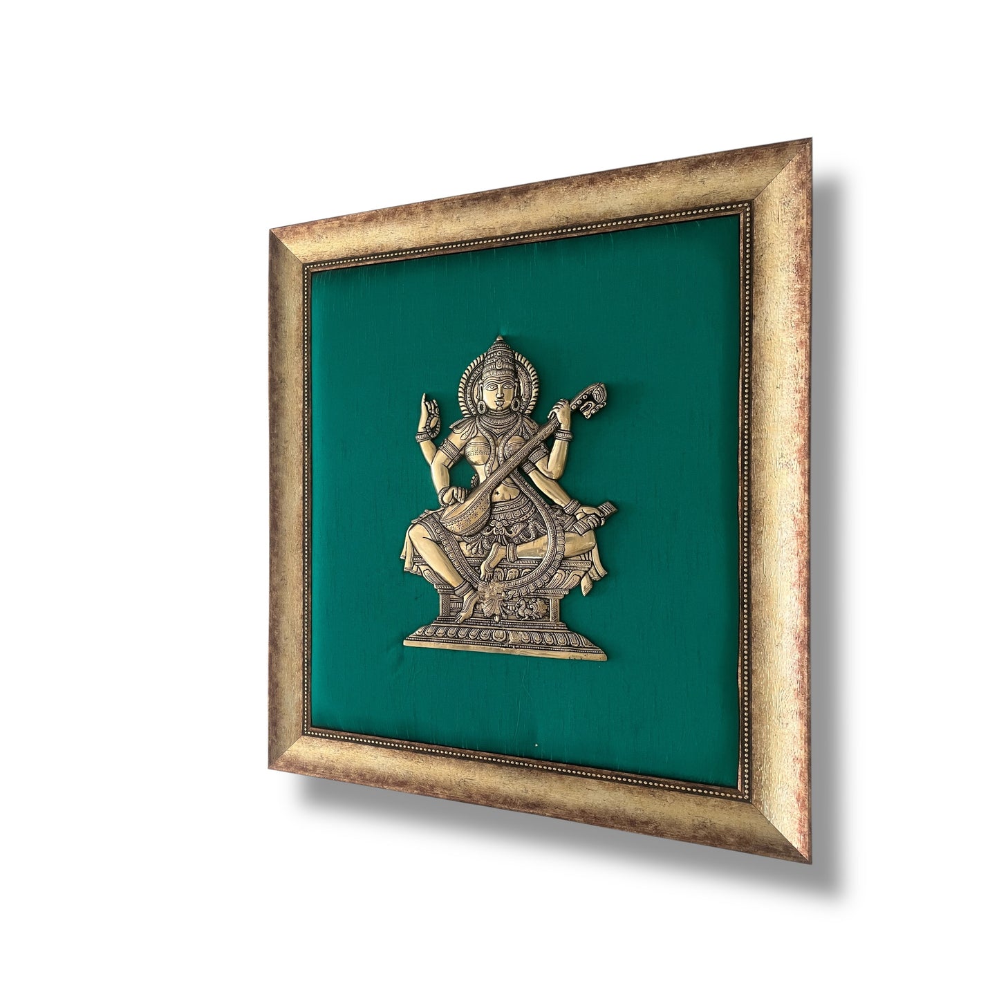 Brass Saraswati on White silk Backdrop in Wooden frame
