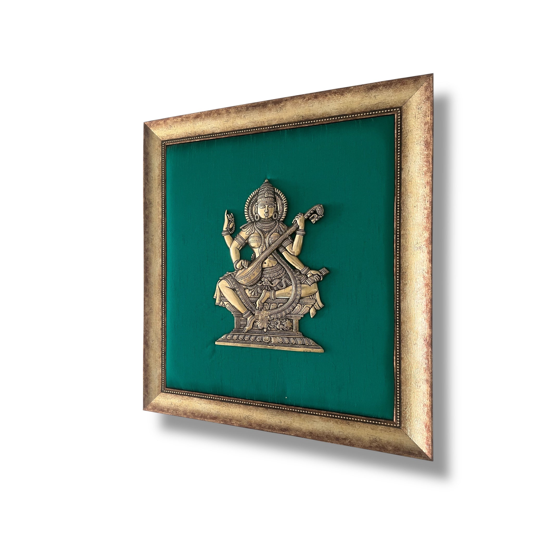 Brass Saraswati on Silk Backdrop in Antique Gold Resin Frame