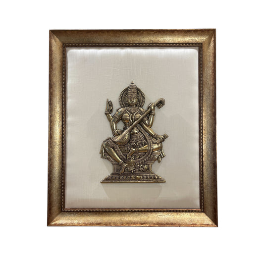 Brass Saraswati on White silk Backdrop in Wooden frame