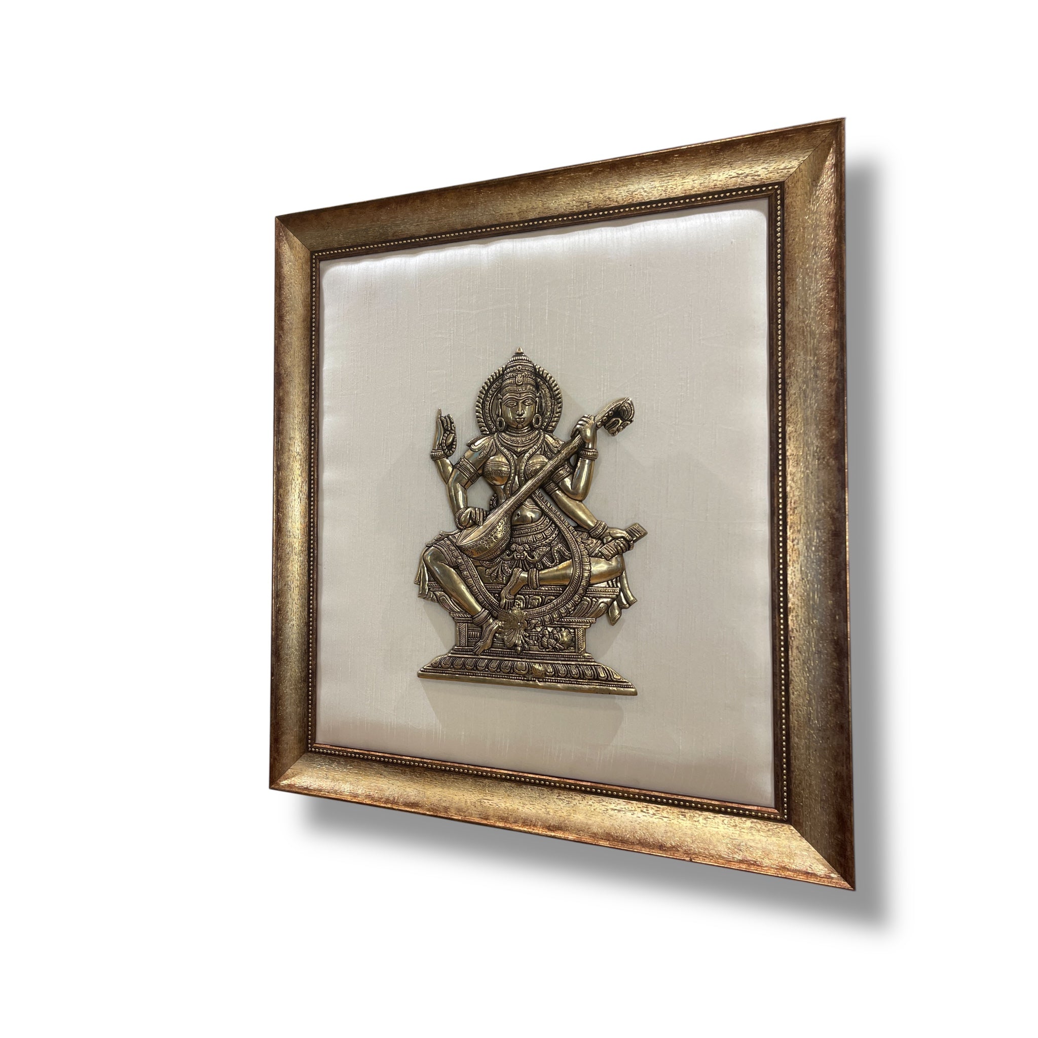 Brass Saraswati on Silk Backdrop in Antique Gold Resin Frame