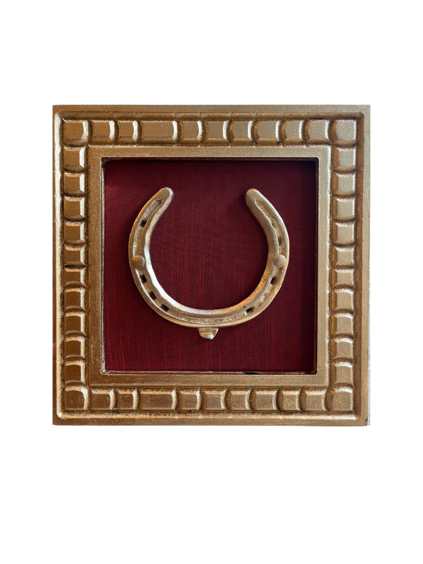 Good Luck Brass Horse Shoe with a wine red silk background with gold wooden frame