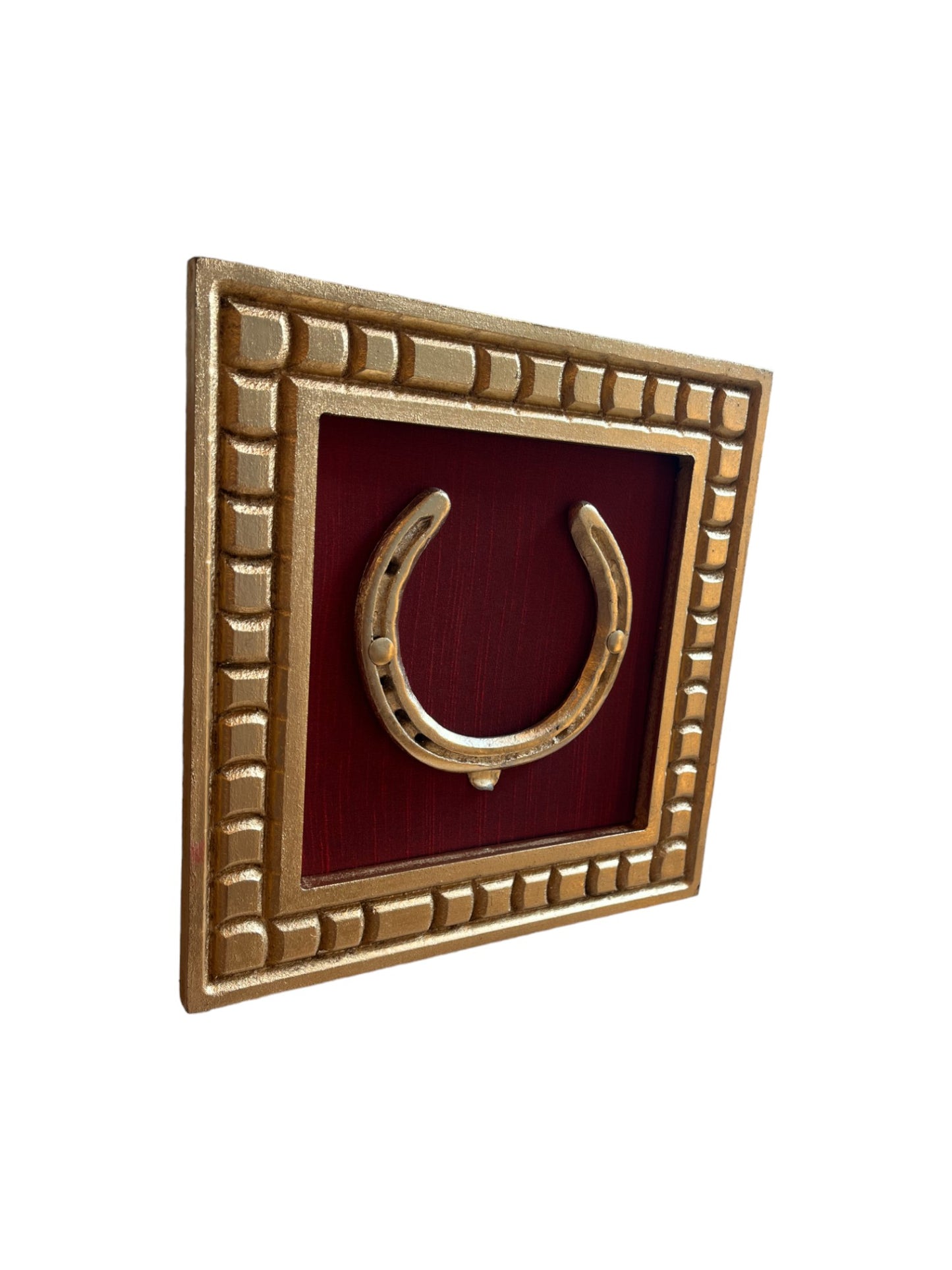 Good Luck Brass Horse Shoe with a wine red silk background with gold wooden frame