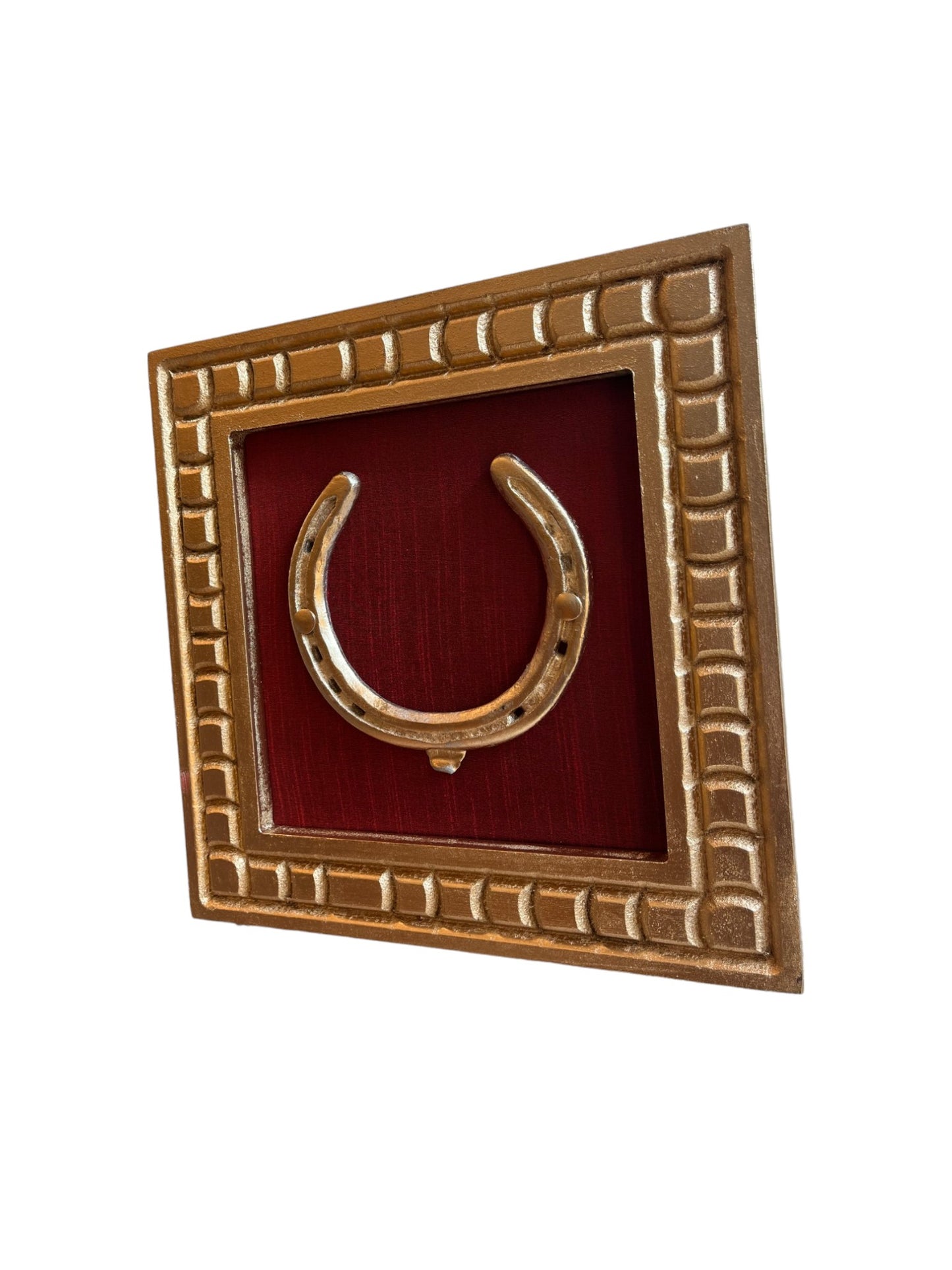 Good Luck Brass Horse Shoe with a wine red silk background with gold wooden frame