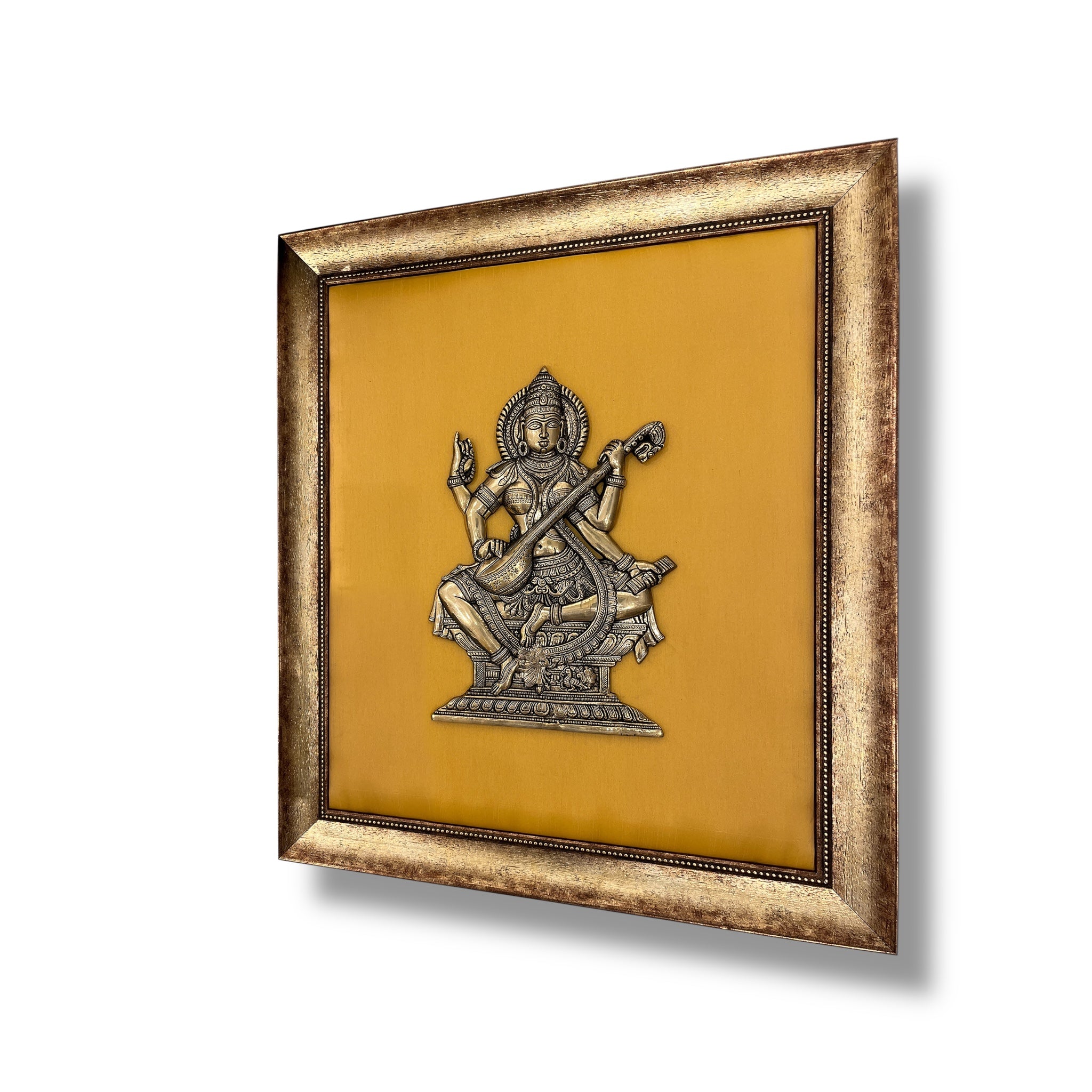 Brass Saraswati on Silk Backdrop in Antique Gold Resin Frame
